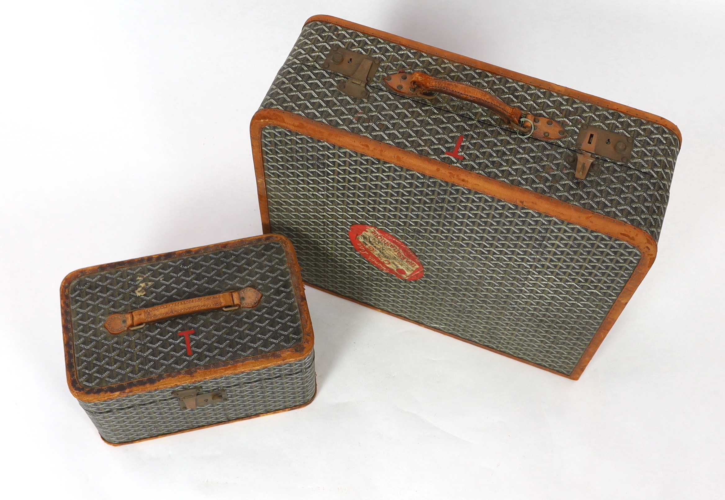 A 1940's Goyard vanity case with matching suitcase, vanity case 37cm wide, 23cm deep, 23cm high; suitcase 59cm wide, 21cm deep, 50cm high